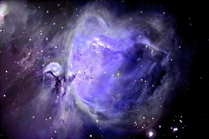 A purple nebula with stars in the background.